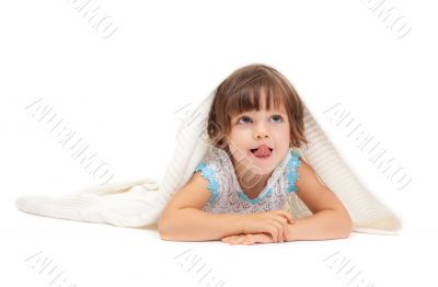Little girl lying on the floor wrapped in a light blanket and to Little girl lying on the floor wrapped in a light blanket and to