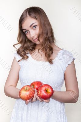 Girl with three apples in their hands Girl with three apples in their hands