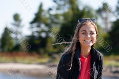 beautiful girl with an ear in his teeth against the backdrop of 