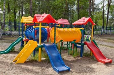 Children colorful playground in park Children colorful playground in park