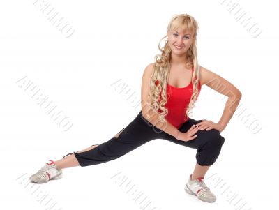 Beautiful young blonde is engaged in fitness, demonstrates the f