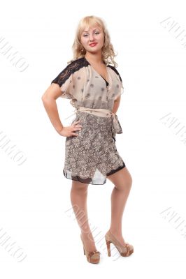 Full length portrait of trendy young woman in elegant beige dres Full length portrait of trendy young woman in elegant beige dres