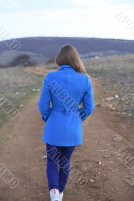 Girl in a blue coat