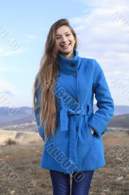 Girl in a blue coat