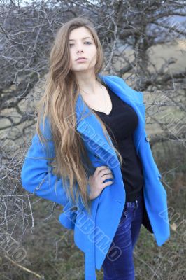 Girl in a blue coat