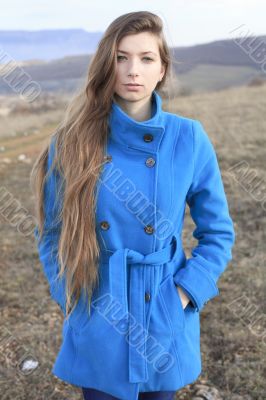 Girl in a blue coat