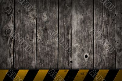 wooden background with warning bar