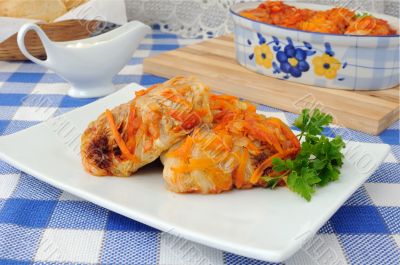 Cabbage rolls in tomato gravy with onions and carrots