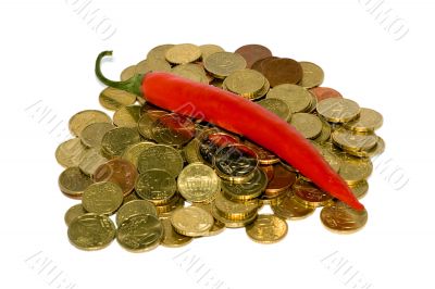 Heap of coins and red hot chili peppers Heap of coins and red hot chili peppers