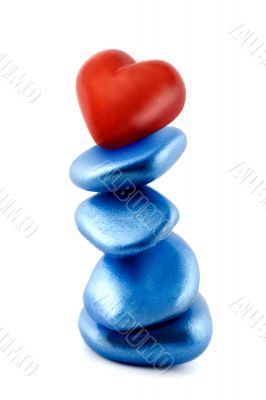 balance red heart in stone