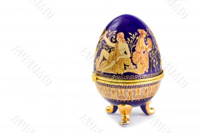 Casket in the form of an Easter egg with an ornament.