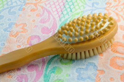 Wooden brush with the handle for massage of a body and a towel. 