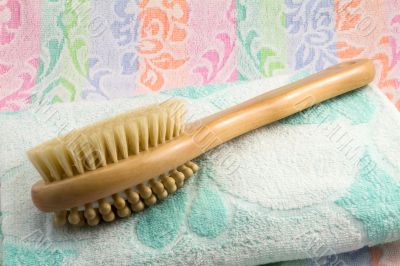 Wooden brush with the handle for massage of a body and a towel. 