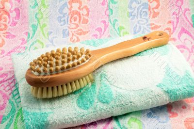 Wooden brush with the handle for massage of a body and a towel. 