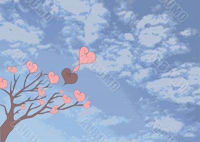 Tree with hearts against the cloudy sky