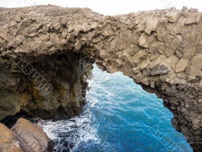 Basalt bridge over sea