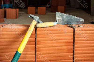 Hammer and trowel on construction site