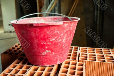 Bucket on hollow bricks