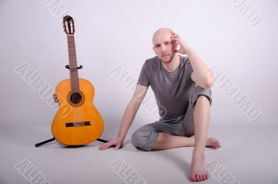 Nice bald guy with a guitar