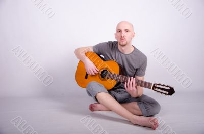 Nice bald guy with a guitar