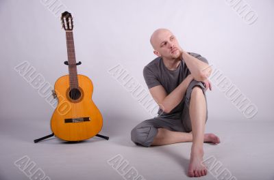 Nice bald guy with a guitar