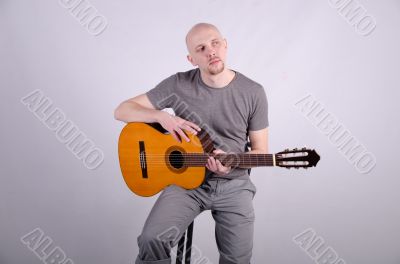 Nice bald guy with a guitar