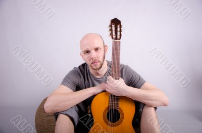 Nice bald guy with a guitar