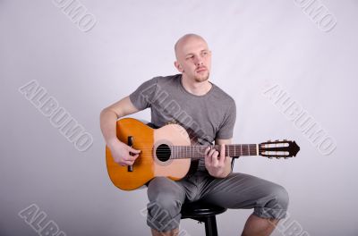 Nice bald guy with a guitar
