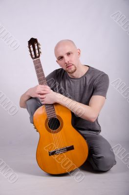 Nice bald guy with a guitar Nice bald guy with a guitar
