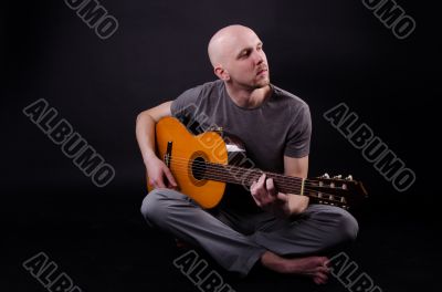 Nice bald guy with a guitar