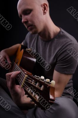 Nice bald guy with a guitar