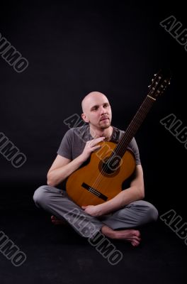 Nice bald guy with a guitar