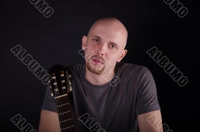 Nice bald guy with a guitar