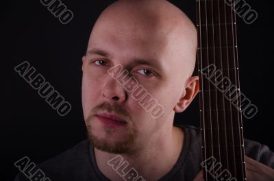 Nice bald guy with a guitar