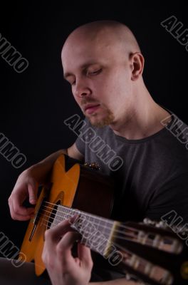 Nice bald guy with a guitar