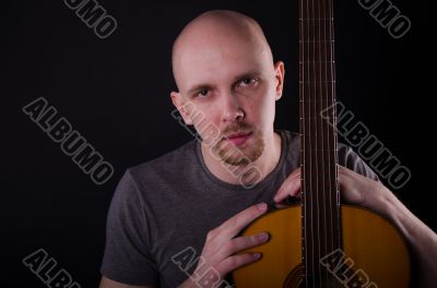 Nice bald guy with a guitar Nice bald guy with a guitar