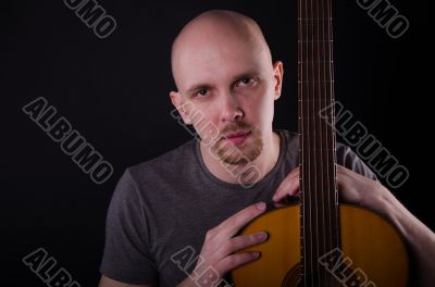 Nice bald guy with a guitar