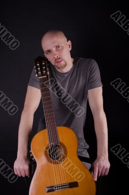 Nice bald guy with a guitar