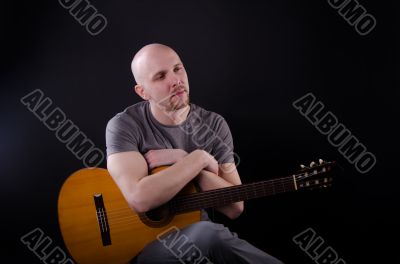 Nice bald guy with a guitar