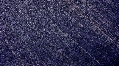 Close up of fresh asphalt with tracks of wheels