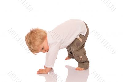 Young boy learning to walk