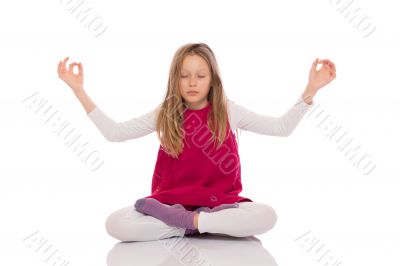 Young girl making yoga