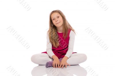 Young girl making faces on the floor