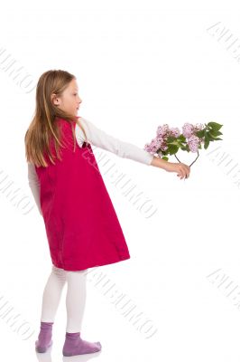 Beautiful young girl with lilac flowers