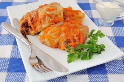 Stuffed cabbage stewed in tomato gravy with onions and carrots