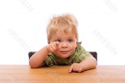 Little child pointing finger to someone Little child pointing finger to someone