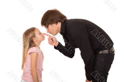 Despairing father pointing finger at his daughter
