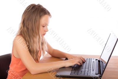 Young girl working on a laptop