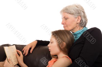 â€‹â€‹Grandmother read a book with her â€‹â€‹granddaughter