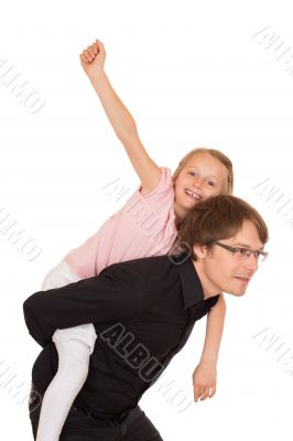 Father giving piggyback ride to his daughter